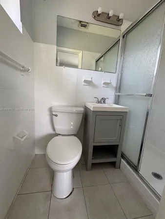 a bathroom with a toilet and a sink