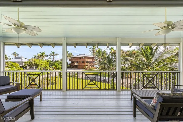 a view of a balcony with chairs