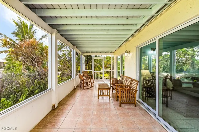 a lobby with furniture and large windows