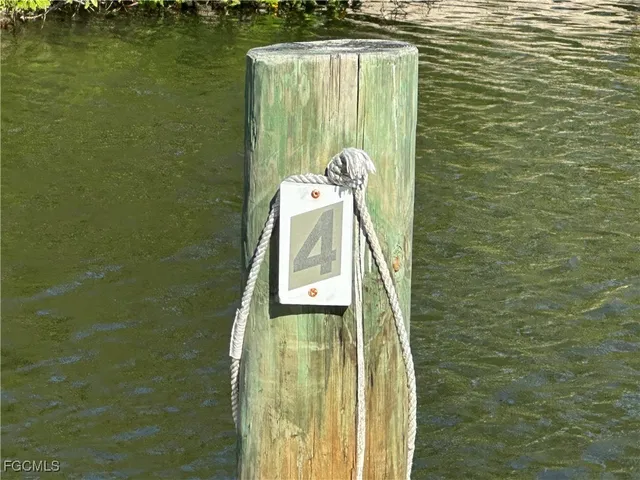 a view of a lake with a house in the background