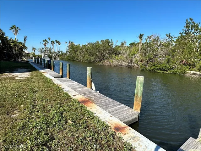 a view of a lake with a house in the background
