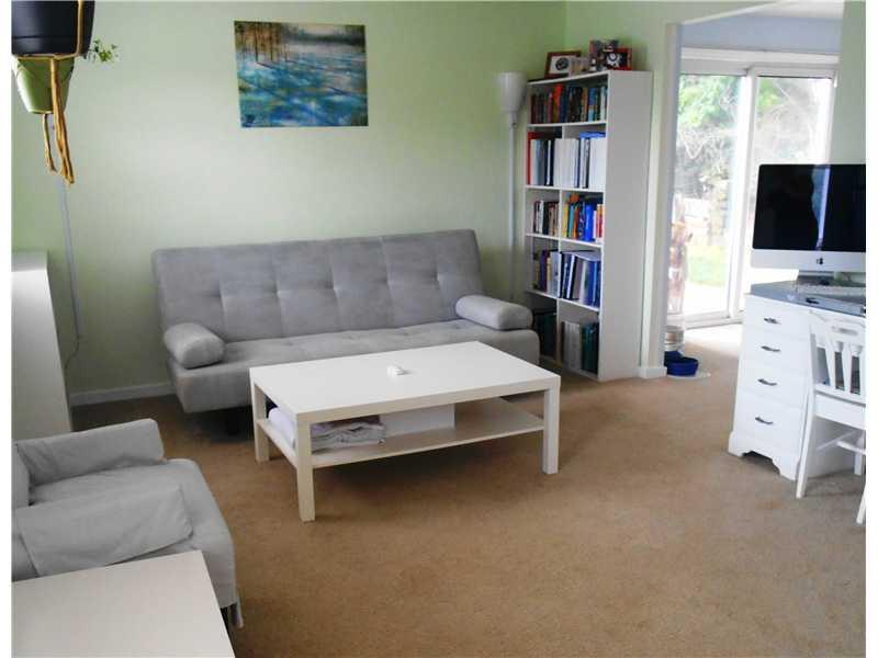 Living Room. Inviting formal living room area with neutral carpet and soft colors.
