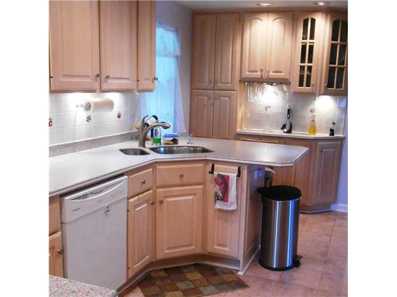 Kitchen. Breakfast bar and tons of cabinet and counter space with these gorgeous corian counter tops.