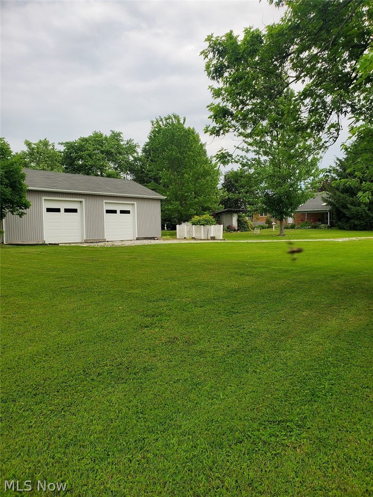 View of yard and garage