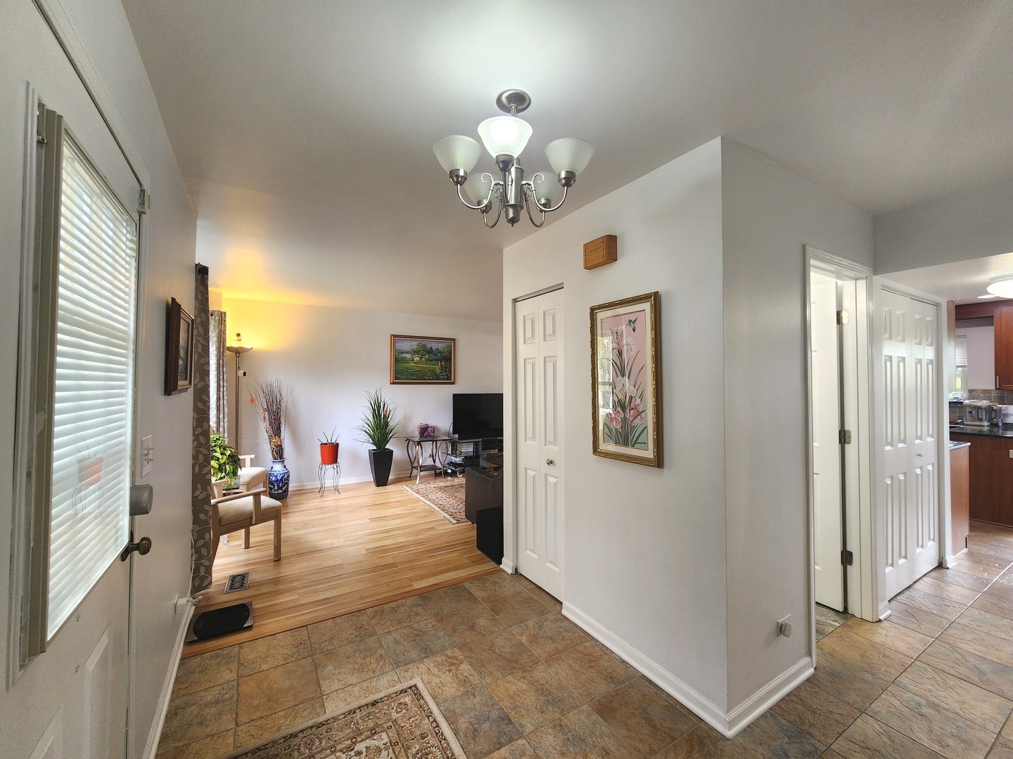 72 Wilton Lane Mundelein, IL 60060 - Photo 2 of 40 a view of a livingroom with a chandelier furniture and windows