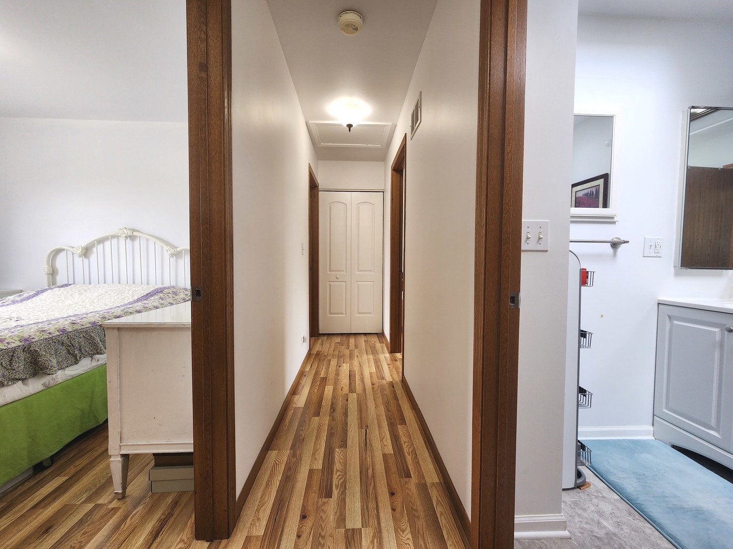 72 Wilton Lane Mundelein, IL 60060 - Photo 26 of 40 a view of a hallway with wooden floor and staircase