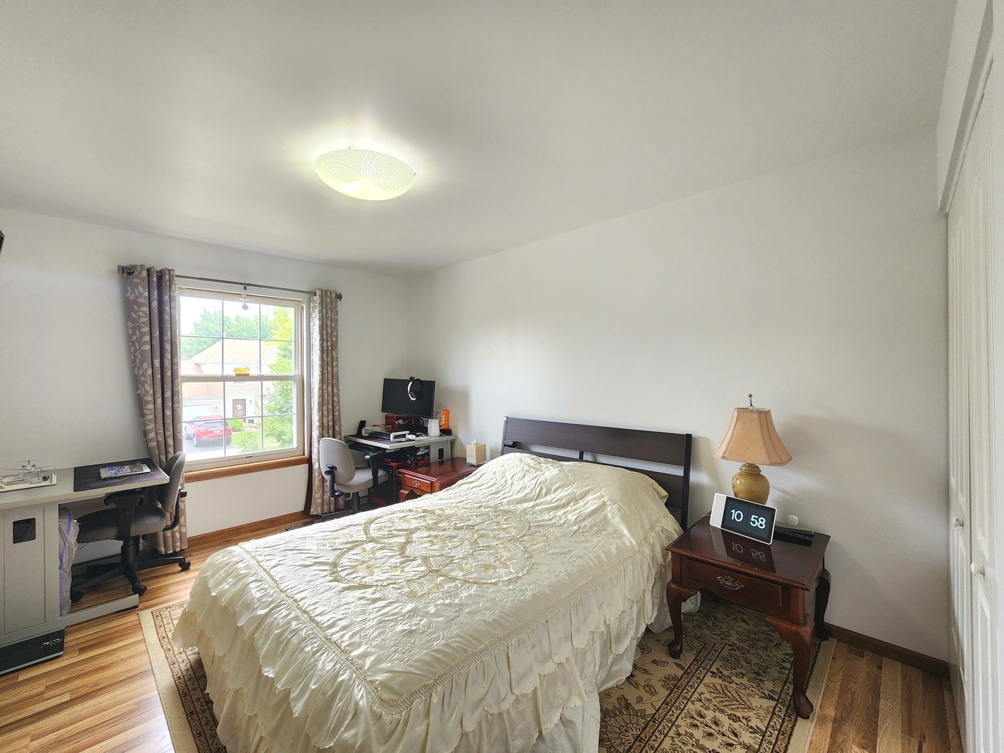 72 Wilton Lane Mundelein, IL 60060 - Photo 34 of 40 a bedroom with a bed and wooden floor