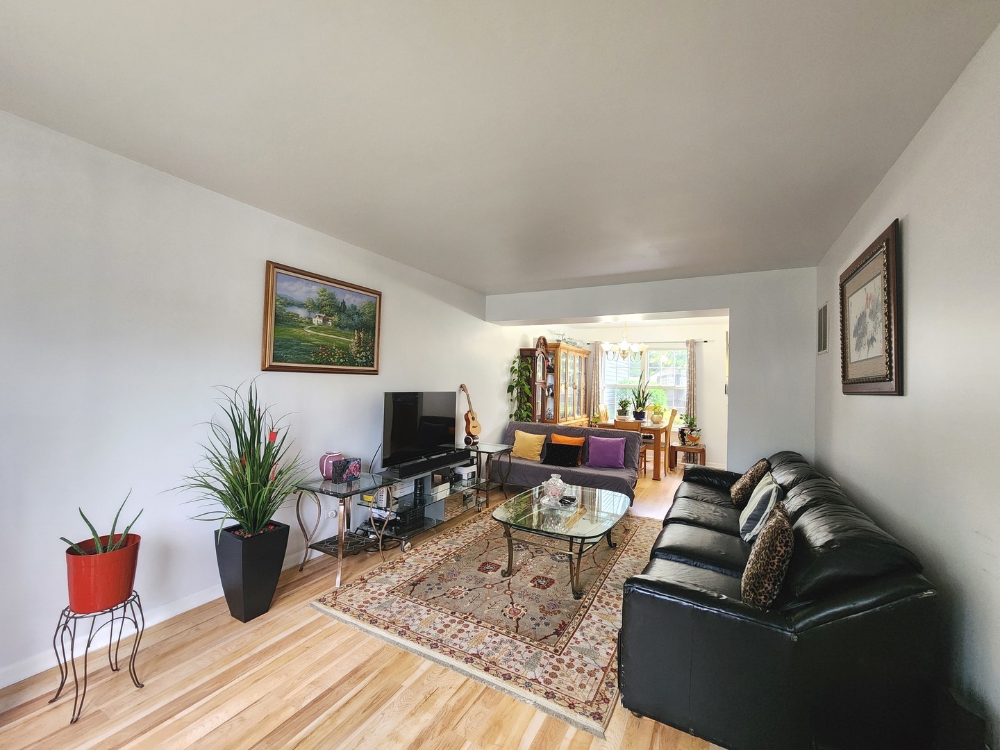 72 Wilton Lane Mundelein, IL 60060 - Photo 9 of 40 a living room with furniture potted plant and a window