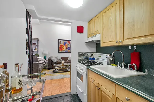 a kitchen with stainless steel appliances granite countertop a stove and a refrigerator