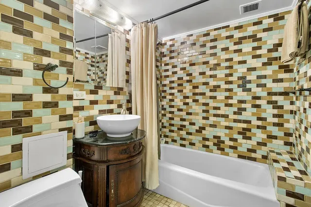 a kitchen with stainless steel appliances granite countertop a sink dishwasher stove and cabinets