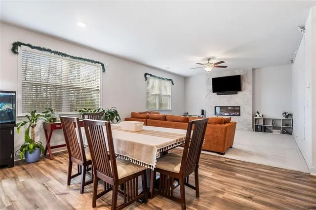 a view of a dining room with furniture window and wooden floor