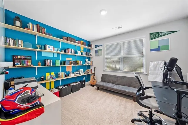 a bedroom with furniture closet and a window