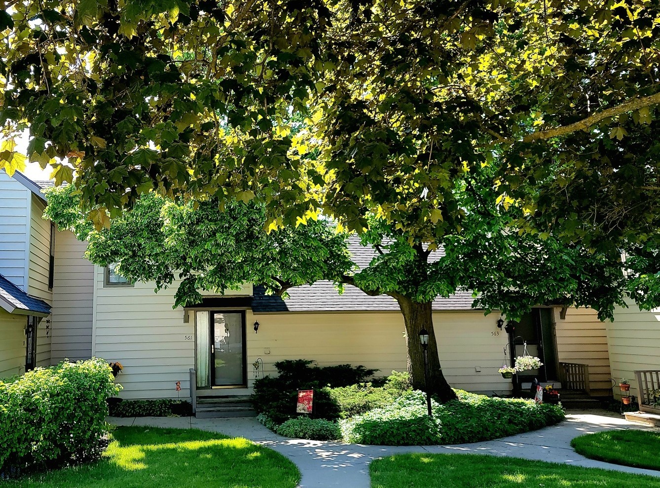 561 Dunham Road Gurnee, IL 60031 - Photo 1 of 30 a front view of a house with a yard garage and outdoor seating