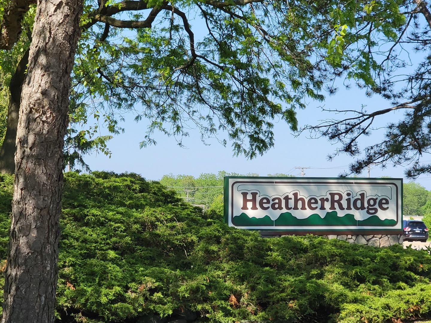 561 Dunham Road Gurnee, IL 60031 - Photo 29 of 30 a sign that is sitting in front of a tree