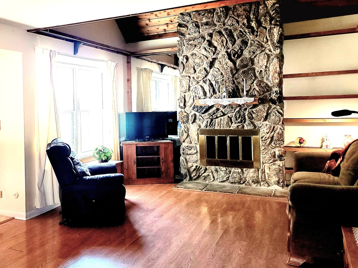 561 Dunham Road Gurnee, IL 60031 - Photo 5 of 30 a living room with furniture a fireplace and a flat screen tv