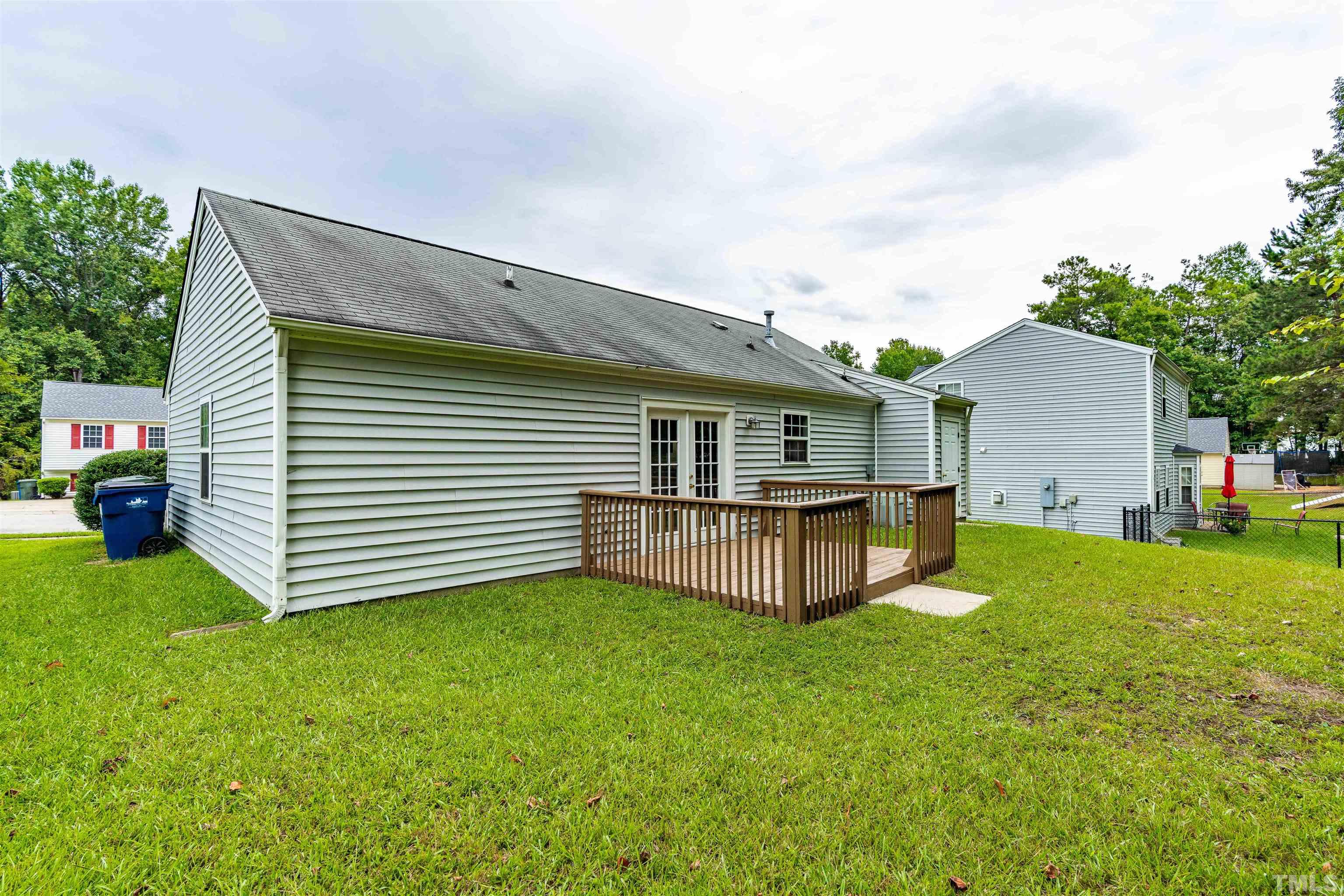 3208 Slippery Elm Drive Raleigh, NC 27610 - Photo 18 of 24 a view of a house with a backyard