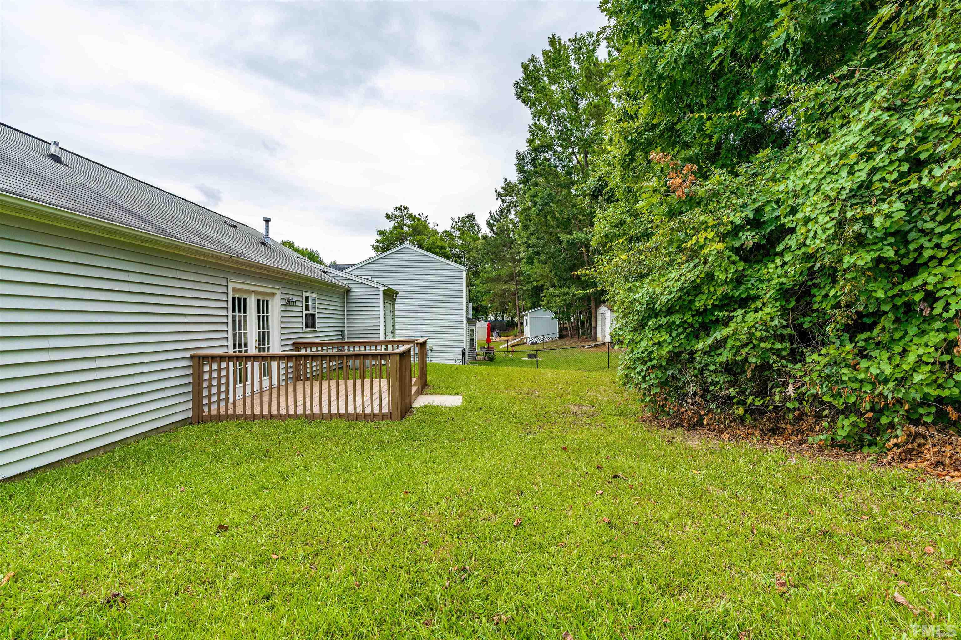3208 Slippery Elm Drive Raleigh, NC 27610 - Photo 19 of 24 a view of a house with backyard and sitting area