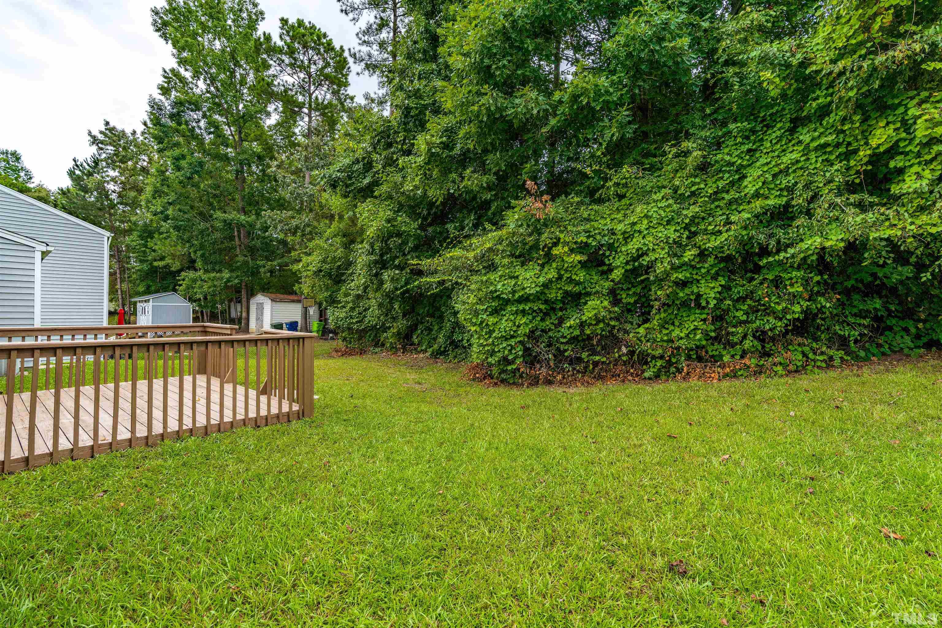 3208 Slippery Elm Drive Raleigh, NC 27610 - Photo 20 of 24 a view of a garden and deck