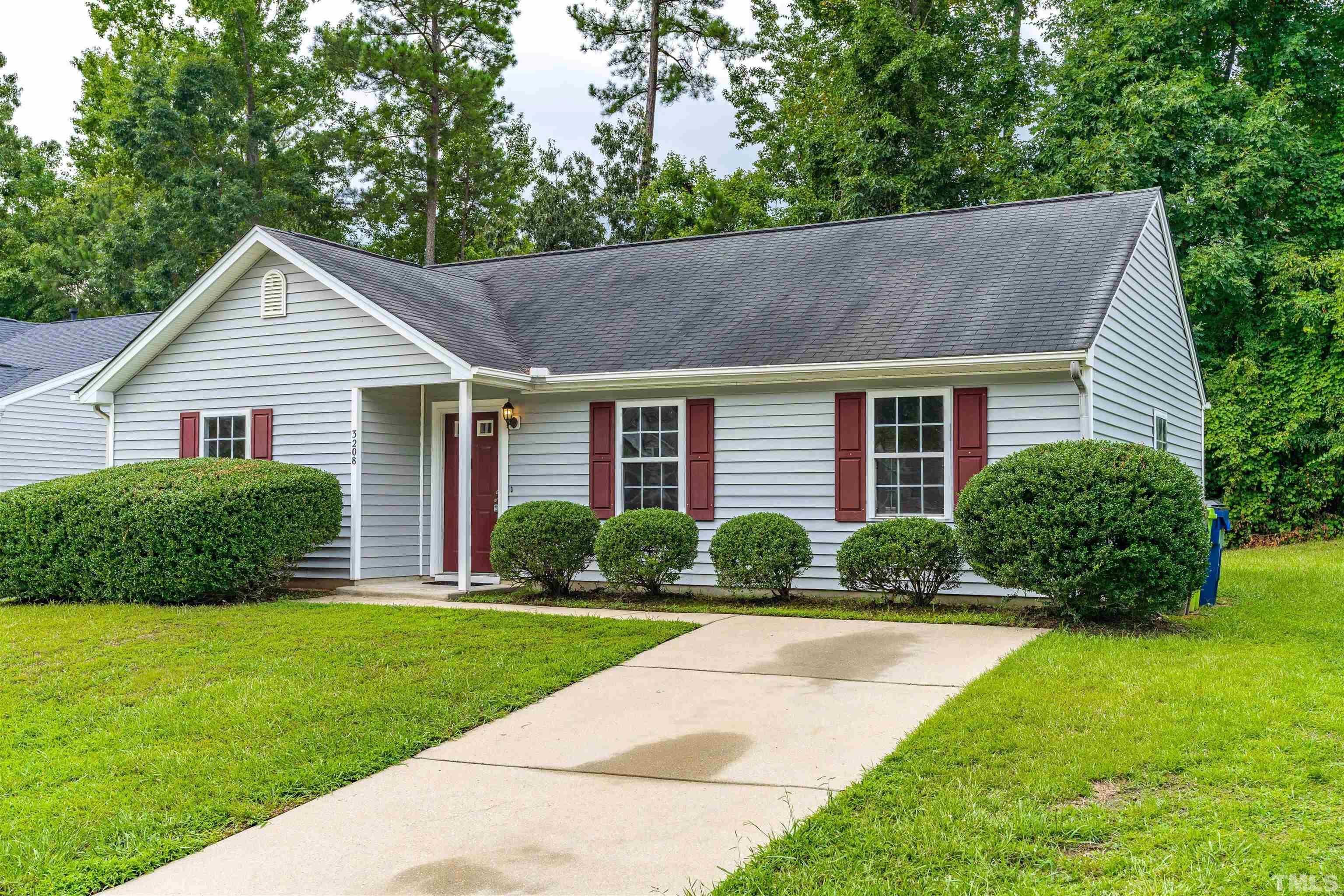 3208 Slippery Elm Drive Raleigh, NC 27610 - Photo 2 of 24 a front view of a house with a yard