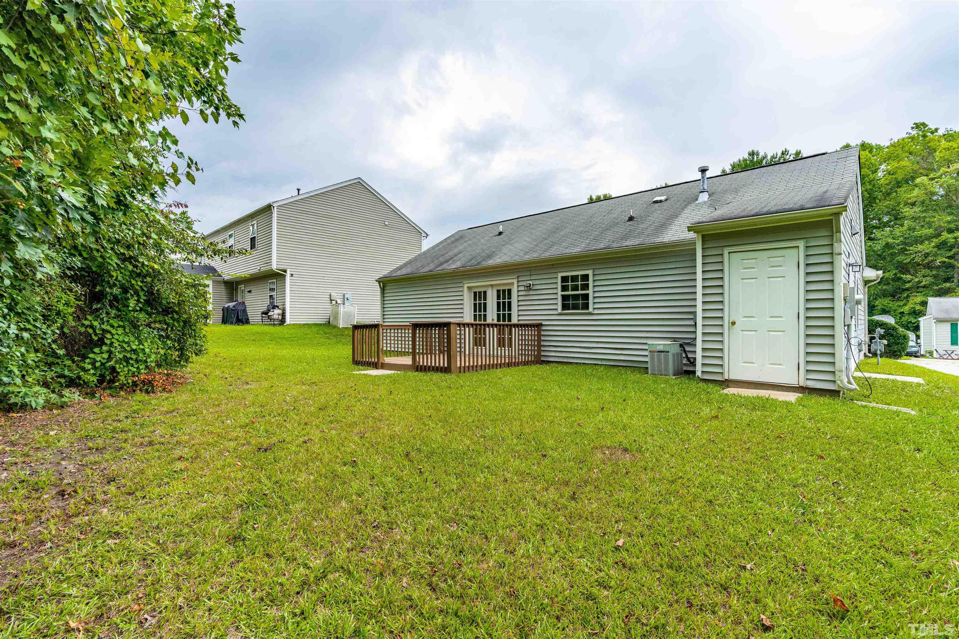3208 Slippery Elm Drive Raleigh, NC 27610 - Photo 21 of 24 a front view of a house with a garden