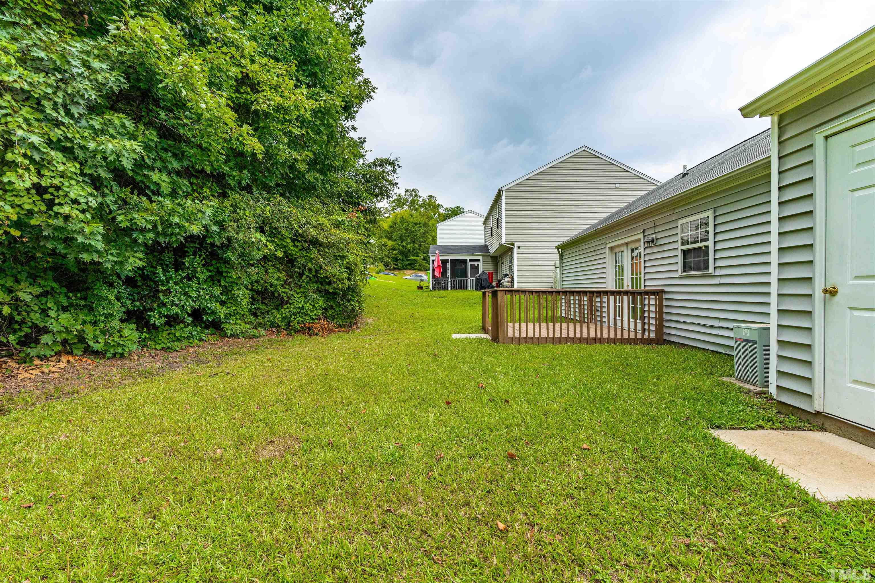 3208 Slippery Elm Drive Raleigh, NC 27610 - Photo 22 of 24 a view of a backyard with a garden