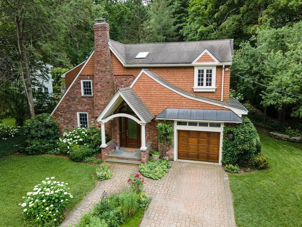 21 Cunningham Road Wellesley, MA 02481 - Photo 1 of 23 a front view of a house with garden