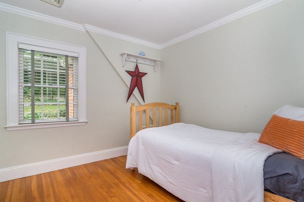 21 Cunningham Road Wellesley, MA 02481 - Photo 18 of 23 a bedroom with a bed and a window