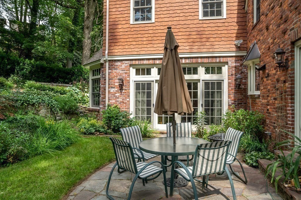 21 Cunningham Road Wellesley, MA 02481 - Photo 19 of 23 a view of a house with backyard and sitting area