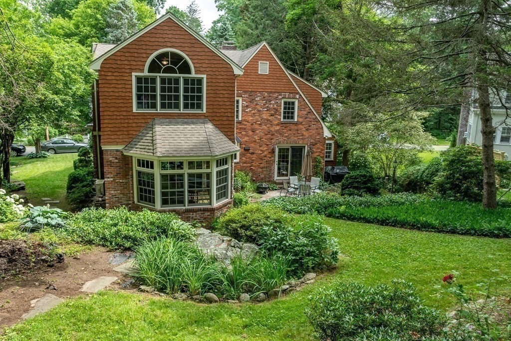 21 Cunningham Road Wellesley, MA 02481 - Photo 21 of 23 a front view of a house with a yard and trees