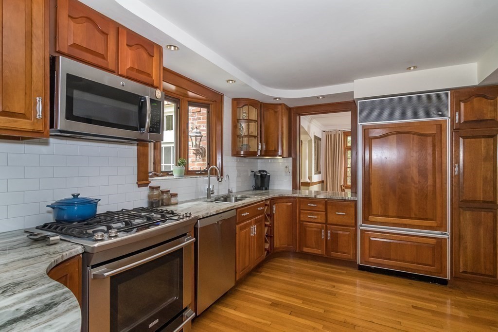21 Cunningham Road Wellesley, MA 02481 - Photo 6 of 23 a kitchen with stainless steel appliances a stove a sink and a microwave