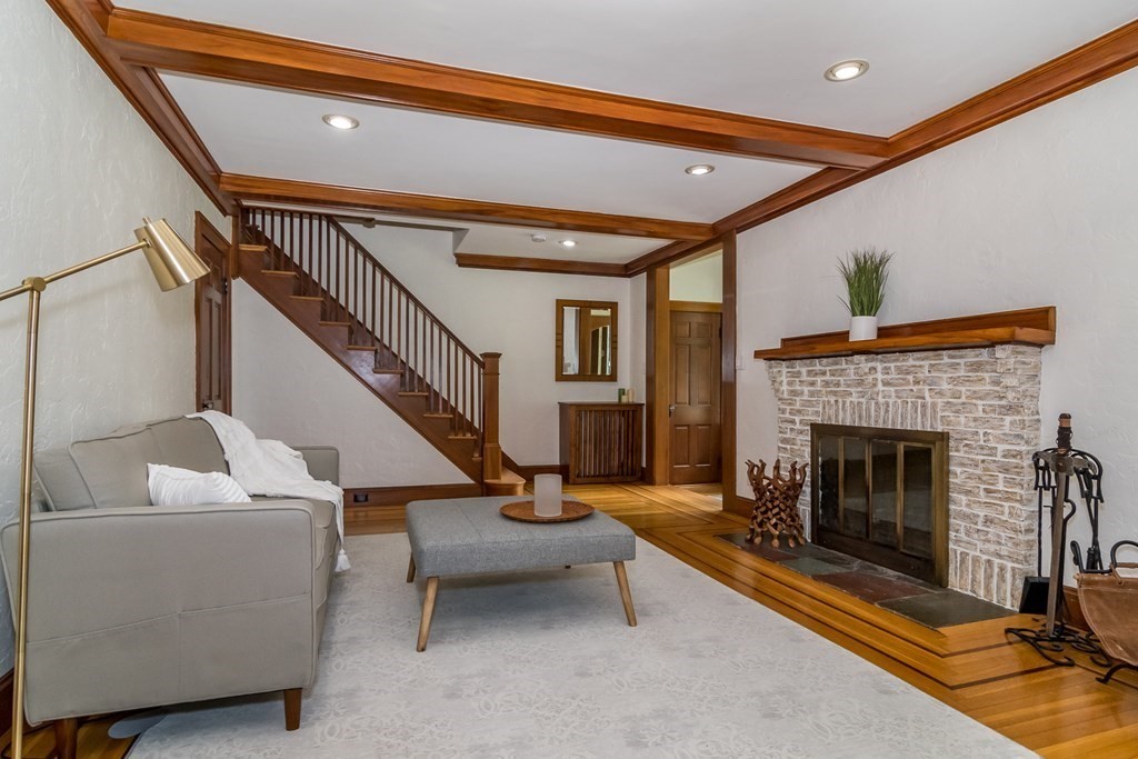21 Cunningham Road Wellesley, MA 02481 - Photo 9 of 23 a living room with furniture and a fireplace