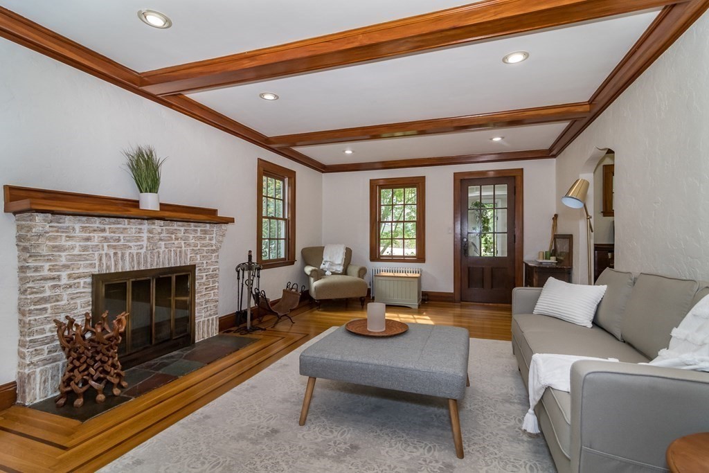 21 Cunningham Road Wellesley, MA 02481 - Photo 10 of 23 a living room with furniture and a fireplace