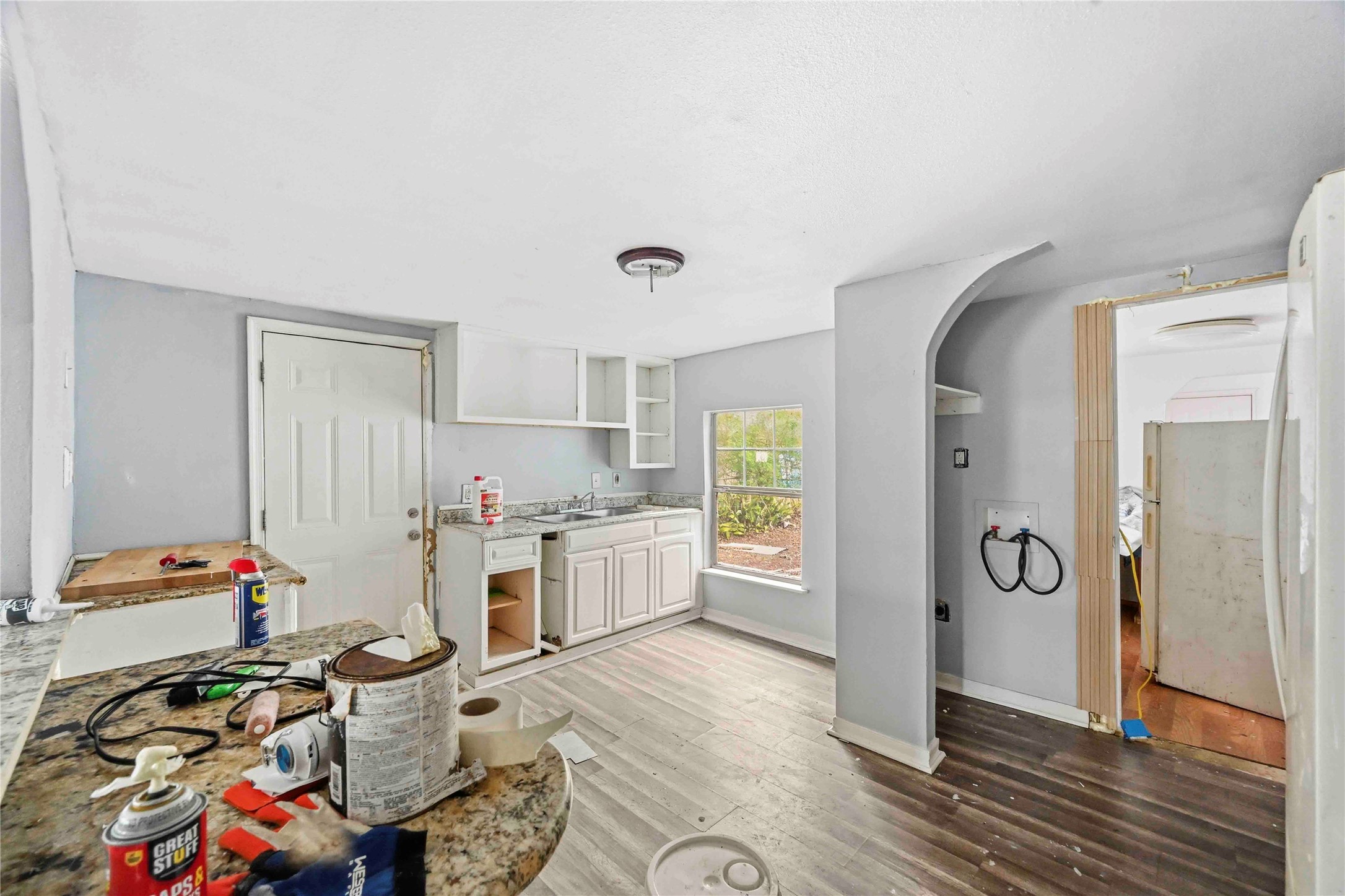 5513 Makeig Street Houston, TX 77026 - Photo 21 of 33 A bright kitchen space with natural light, ample storage, and an open layout, ready for your personal touch and updates.