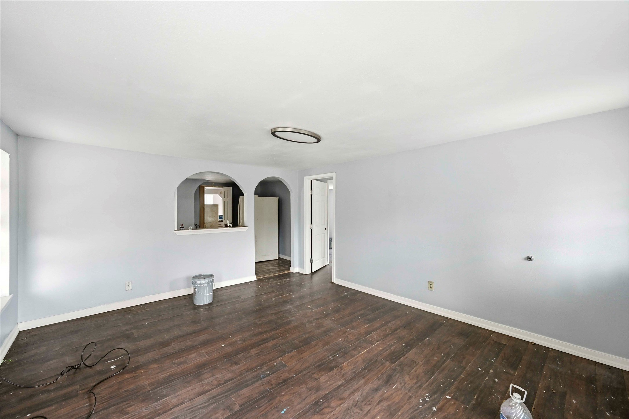 5513 Makeig Street Houston, TX 77026 - Photo 23 of 33 Bright and open space with natural light, a practical layout, and arched openings providing easy flow to nearby rooms.