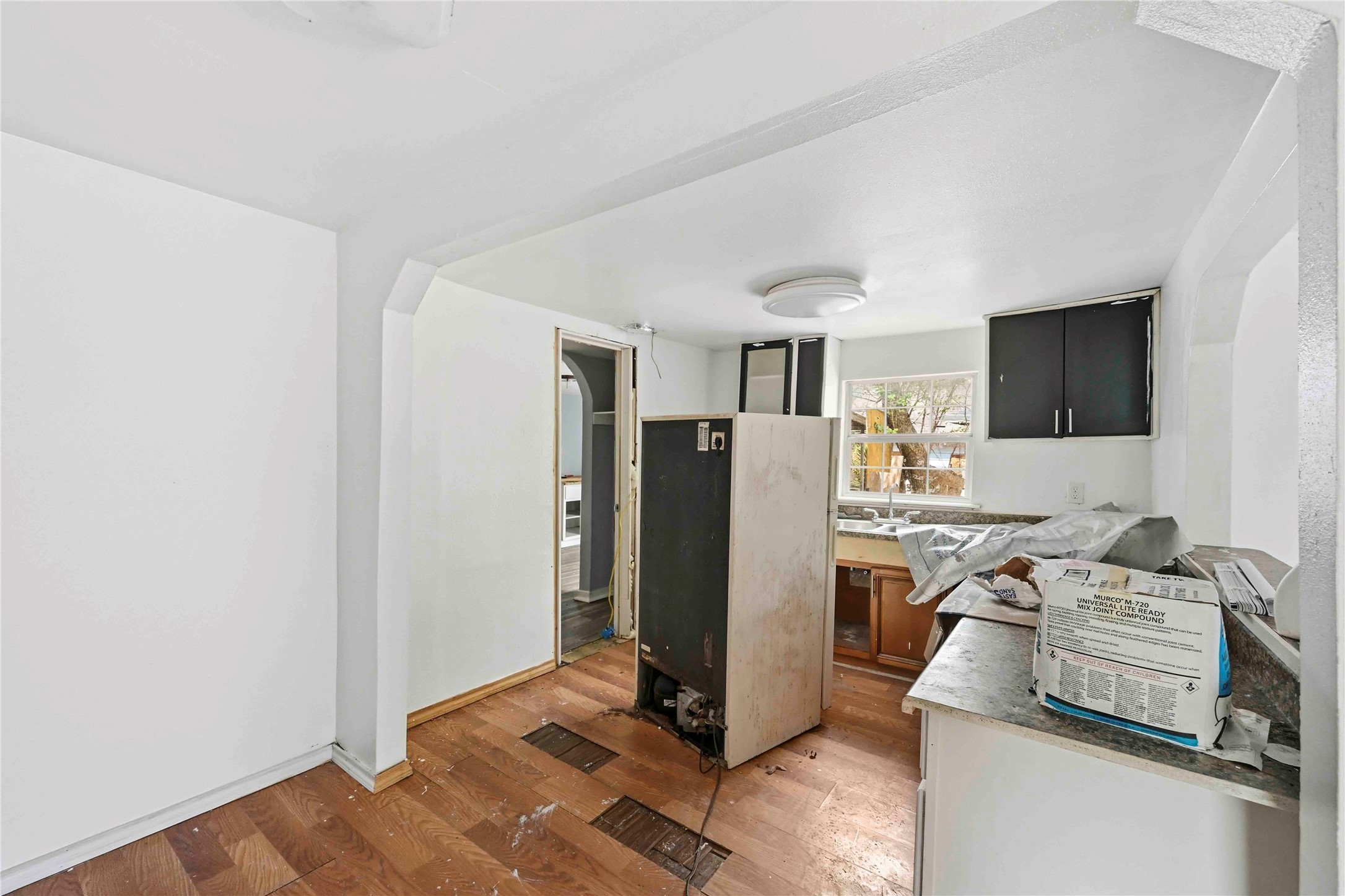 5513 Makeig Street Houston, TX 77026 - Photo 4 of 33 This cozy kitchen space is filled with natural light and ready for a fresh new vision. With warm wooden flooring and a functional layout, it offers the perfect opportunity to create a beautiful space tailored to your style.