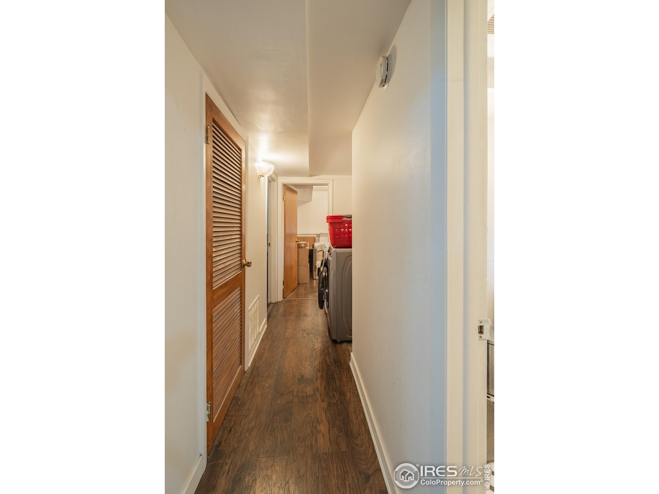 1602 29th Avenue Greeley, CO 80634 - Photo 15 of 18 a view of a hallway with wooden floor