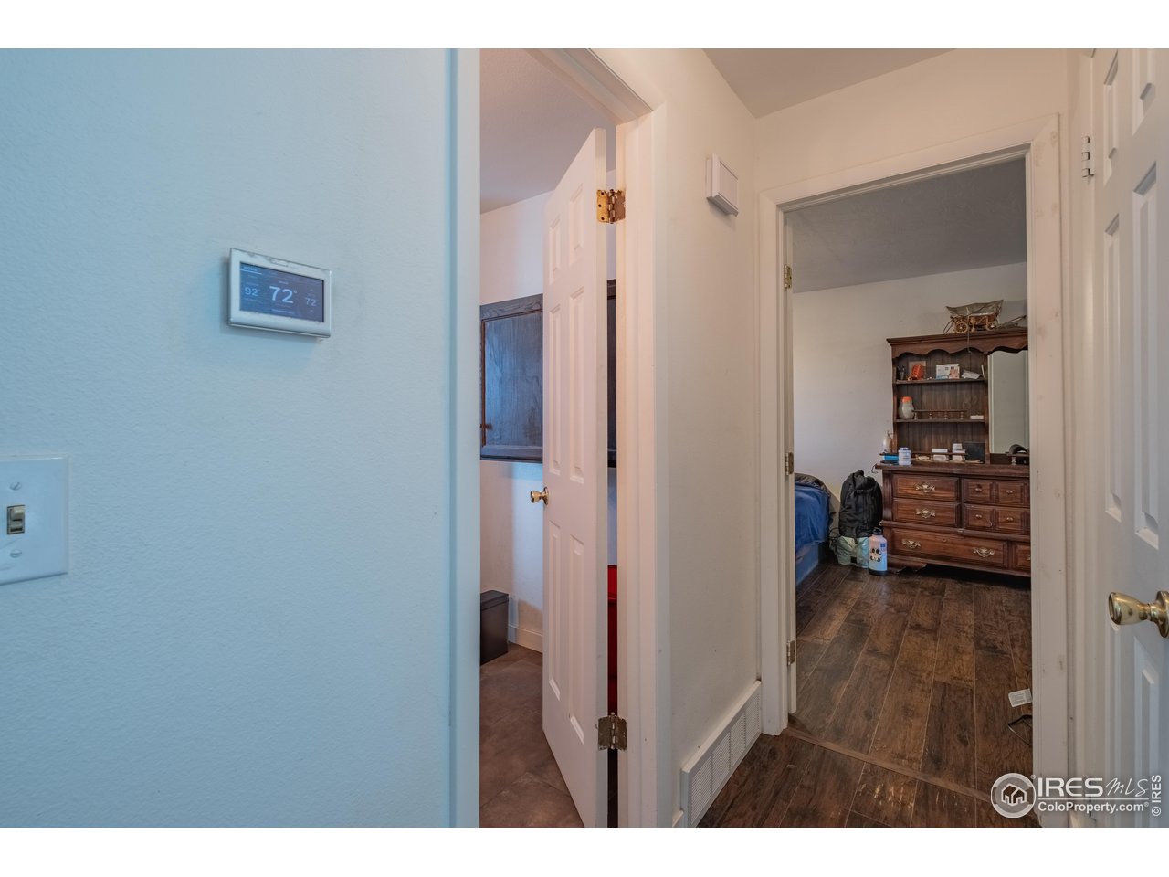 1602 29th Avenue Greeley, CO 80634 - Photo 6 of 18 a view of a hallway with wooden floor and closet