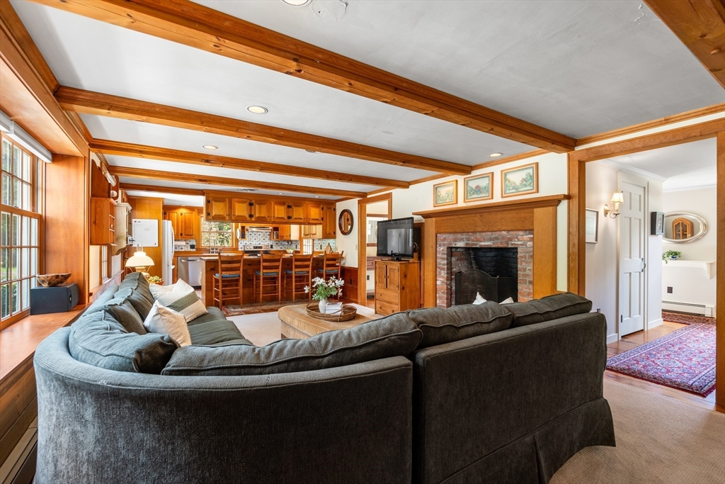84 Hopestill Brown Road Sudbury, MA 01776 - Photo 16 of 42 a living room with fireplace furniture and a large window