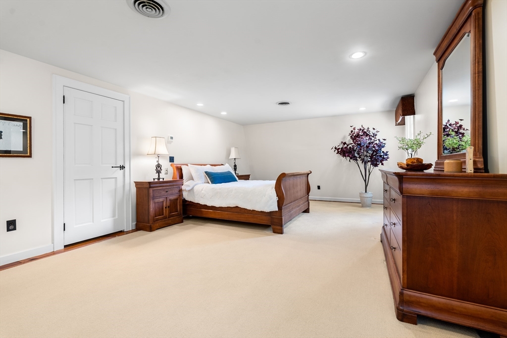 84 Hopestill Brown Road Sudbury, MA 01776 - Photo 24 of 42 a living room with furniture and flowers