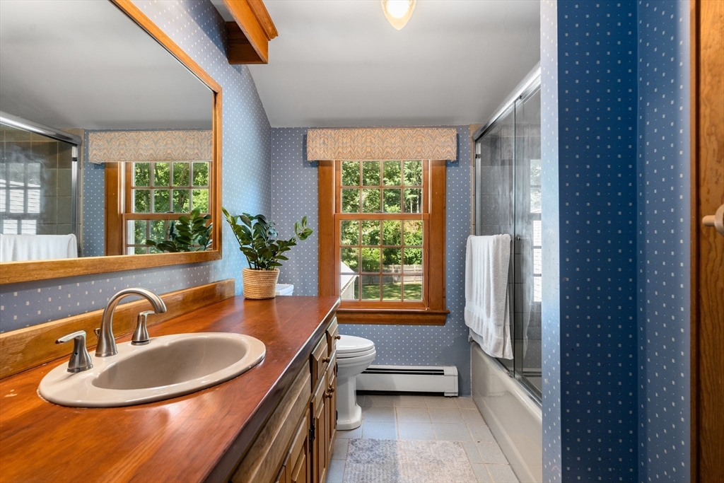 84 Hopestill Brown Road Sudbury, MA 01776 - Photo 26 of 42 a bathroom with a sink a tub and a mirror