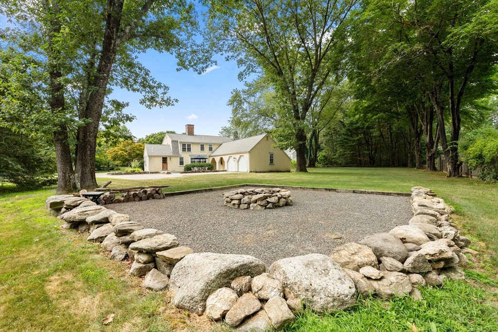 84 Hopestill Brown Road Sudbury, MA 01776 - Photo 32 of 42 a view of a house with a yard and sitting area