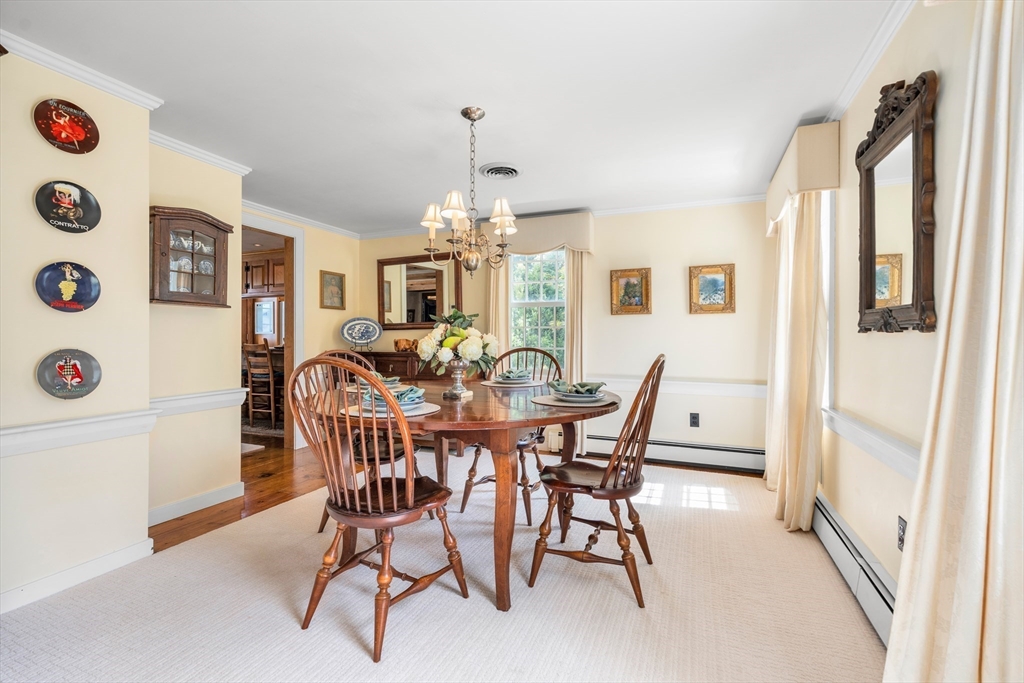 84 Hopestill Brown Road Sudbury, MA 01776 - Photo 8 of 42 a view of a dining room with furniture and chandelier