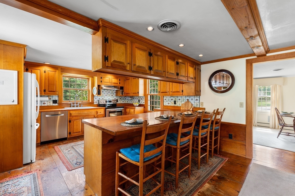 84 Hopestill Brown Road Sudbury, MA 01776 - Photo 10 of 42 a very nice looking dining room with a large window and stainless steel appliances