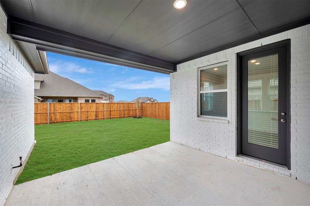 1004 Ashcroft Lane Justin, TX 76247 - Photo 25 of 39 a view of a porch with a backyard