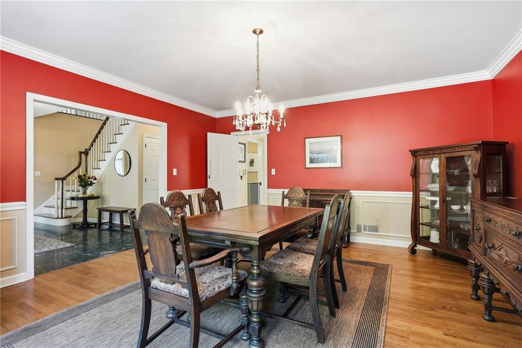 900 Settlers Ridge Road Pittsburgh, PA 15238 - Photo 21 of 50 Classic architectural details and a sparkling crystal chandlier are features of the dining room.