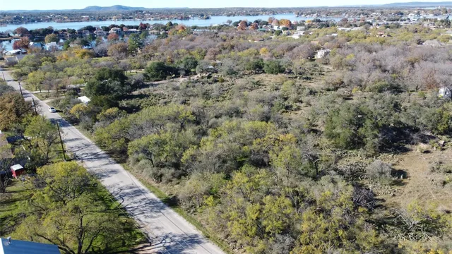 an aerial view of a houses with a yard