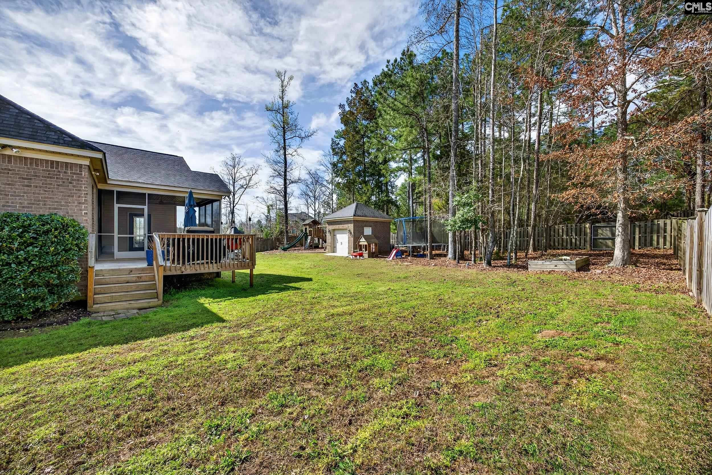 116 Renard Way Gilbert, SC 29054 - Photo 53 of 74 a view of a house with backyard and a tree