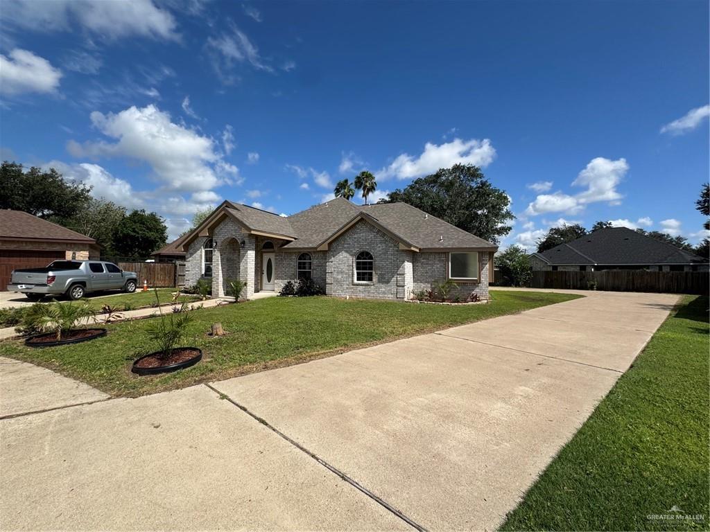 2207 Turtle Court Mission, TX 78572 - Photo 3 of 22 a front view of a house with a yard