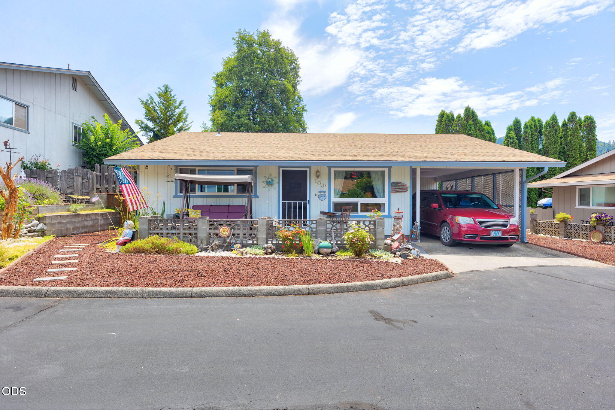 103 Brookside Court Rogue River, OR 97537 - Photo 1 of 27 a front view of a house with a yard and garage