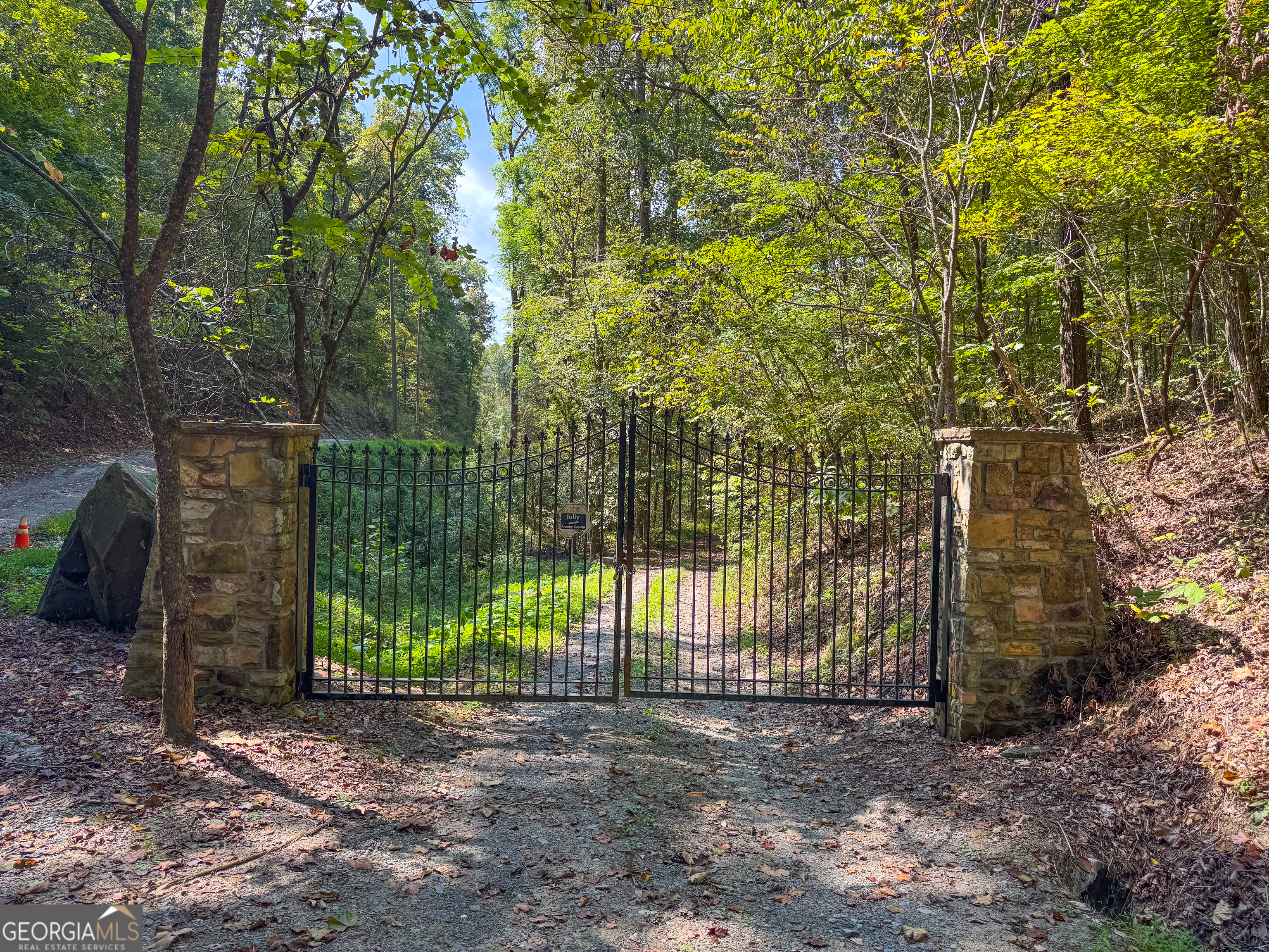 45 Acres On Rambling Road Fairmount, GA 30139 - Photo 5 of 24 a view of a fence with a trees in the background